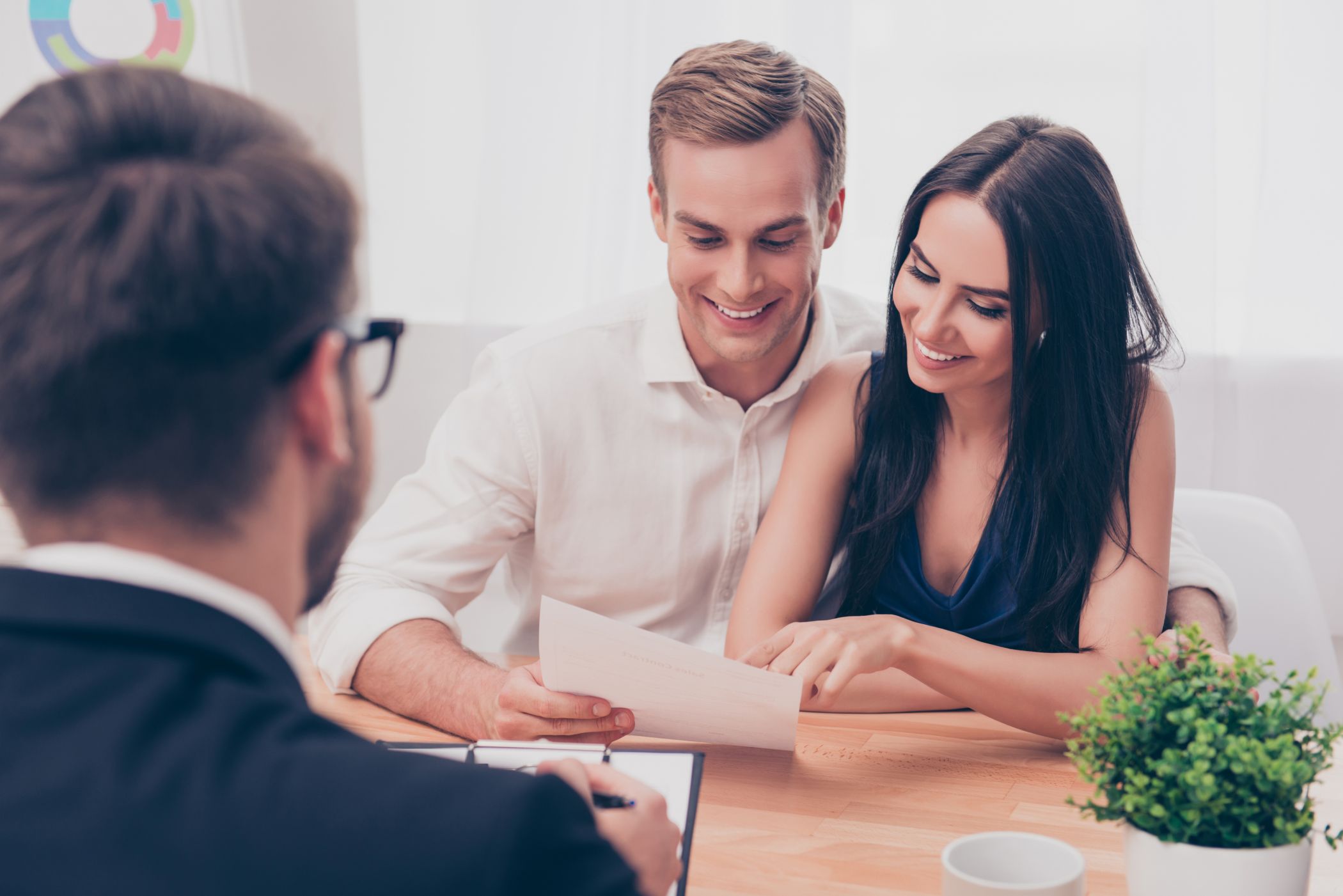 Successful lawyer giving consultation to family couple about buying house Happy business owners see how much their EPA credit is